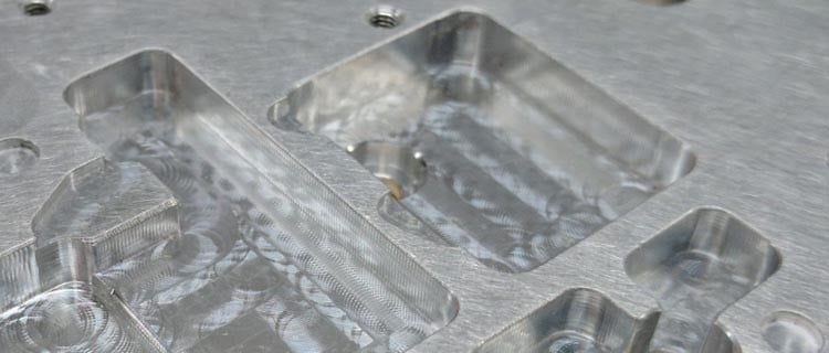 close up of a heat sink base with countersunk pockets and through holes